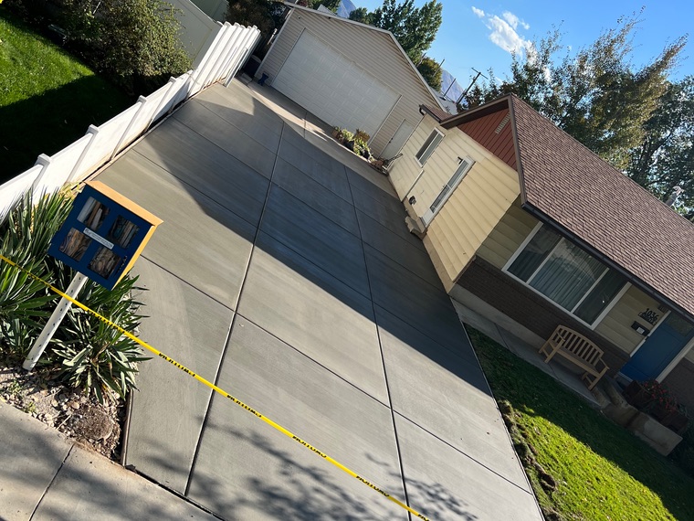 Aerial view of a finished Nxgen concrete driveway with scored control joints