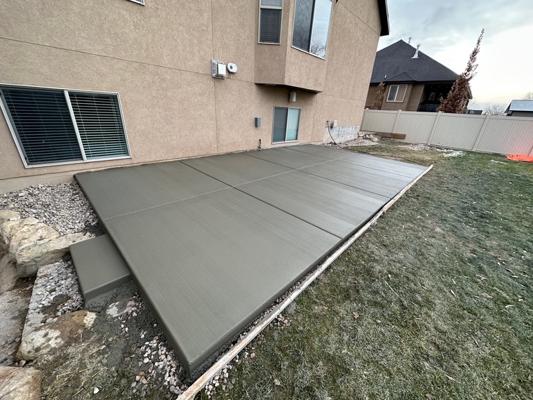 Freshly poured backyard concrete patio slab